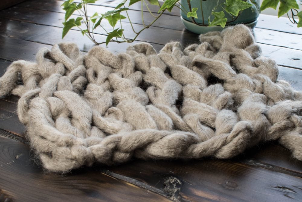 Arm knitting swatch of chunky yarn