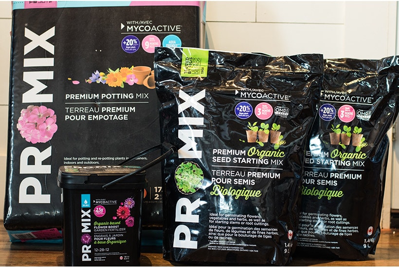 Bags of Promix potting soil, seed starting mix, and flower fertilizer.