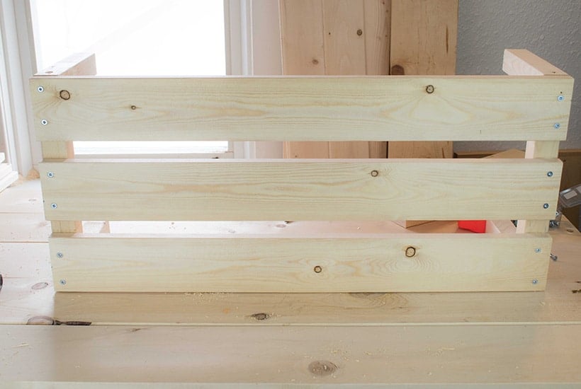 How the bottom of your stackable storage bins should look when the bottom planks are attached.