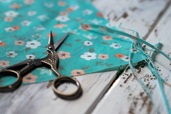 A DIY beeswax wrap trimmed after waxing with a small pair of scissors.