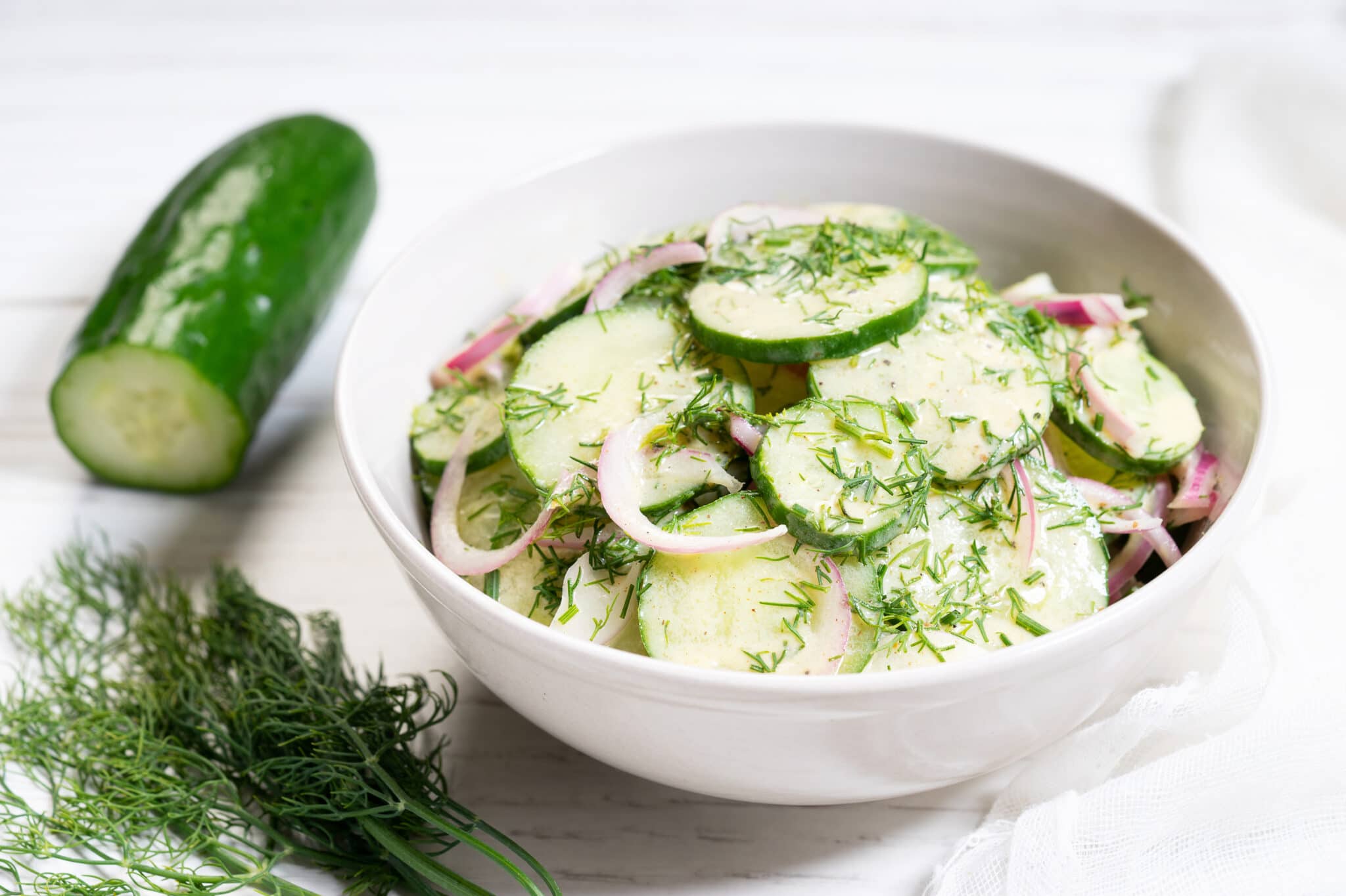 Fresh sliced cucumber salad with dill.