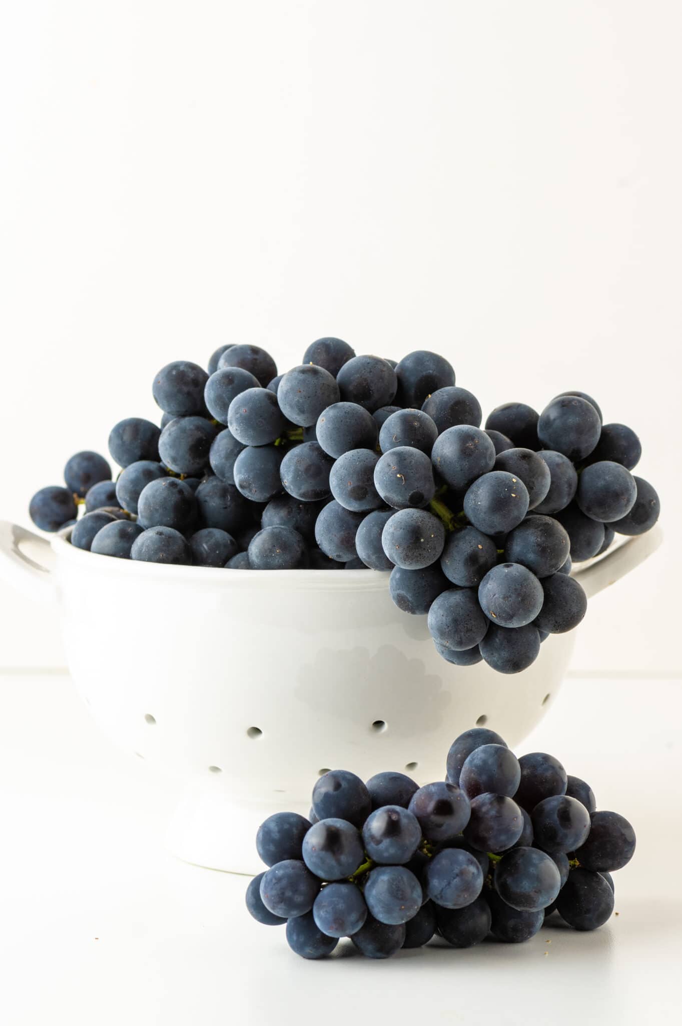 A bowl of purple grapes about to be used to make natural fabric dye.