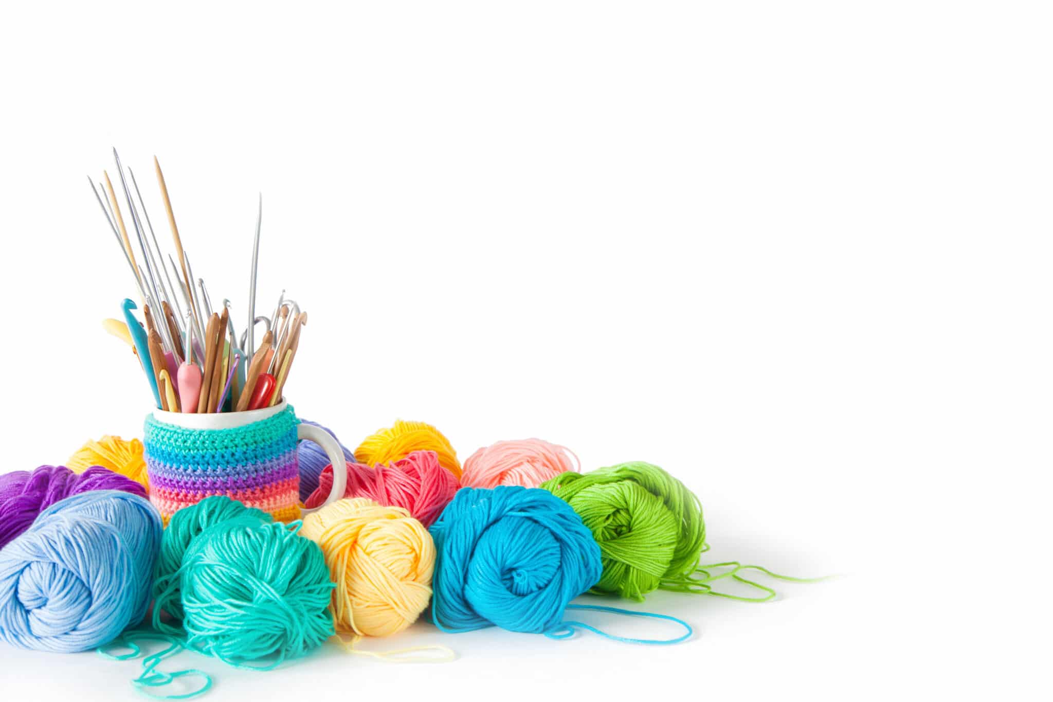 Color yarn for knitting, knitting needles and crochet hooks. White background. Isolate.