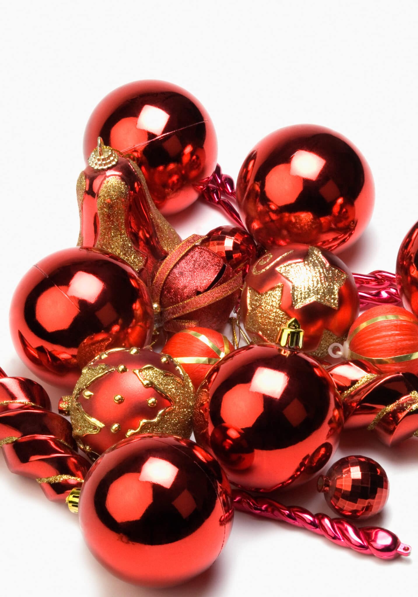 Red Christmas Ornaments organized by color against a bright white background. 