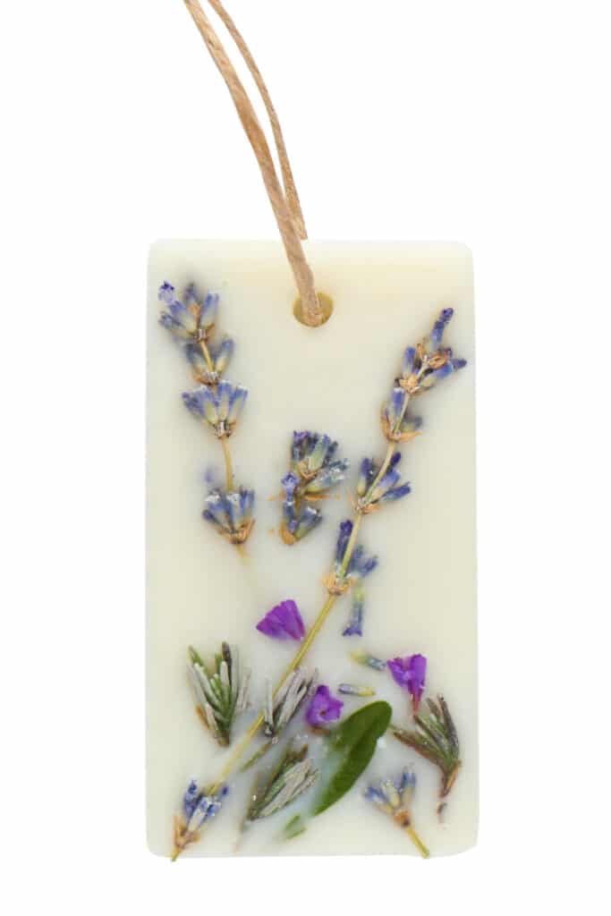 Dried lavender embedded in a slice of homemade soap.