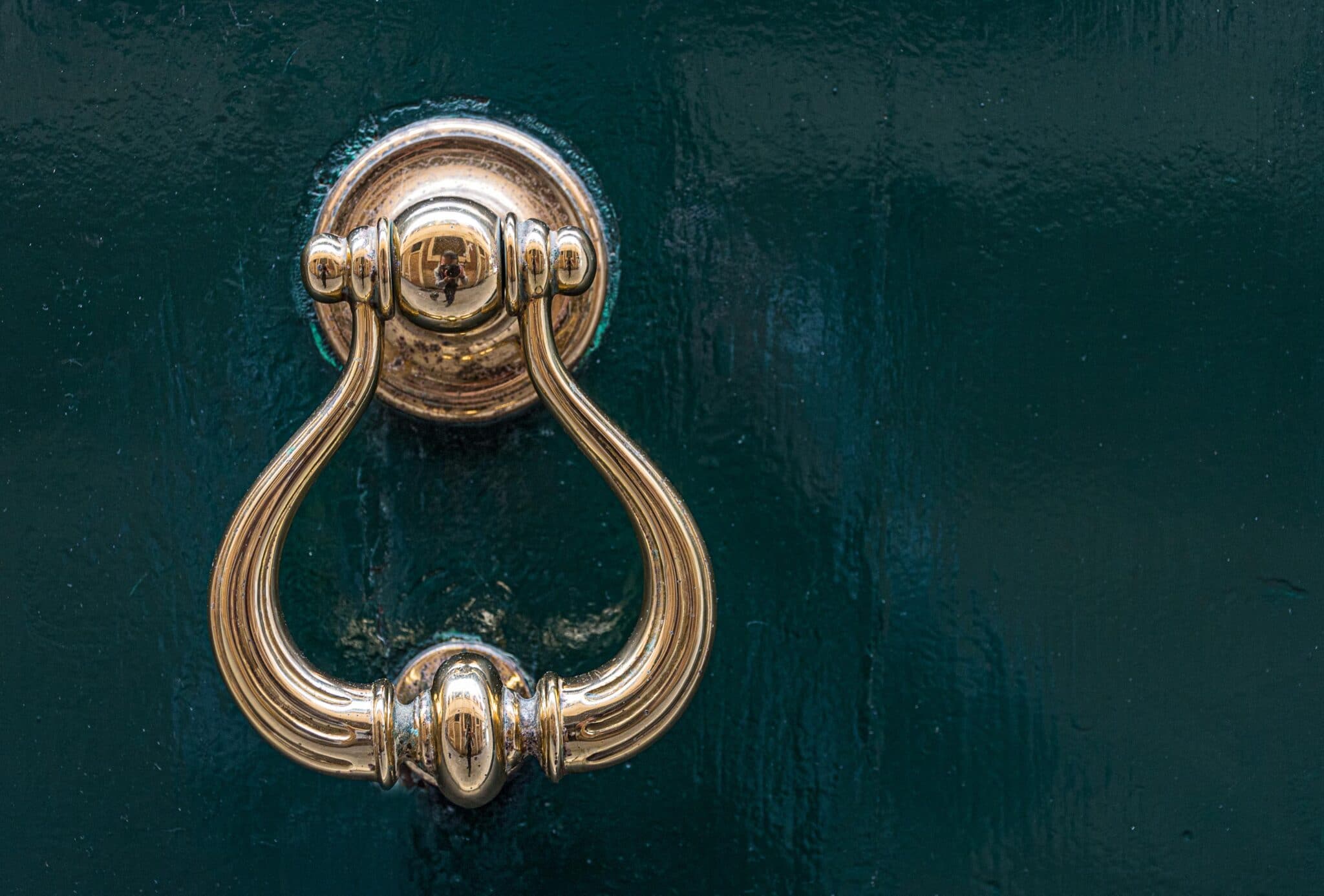 A lovely gold filgree style handle big enough to pull a think throw blanket through.