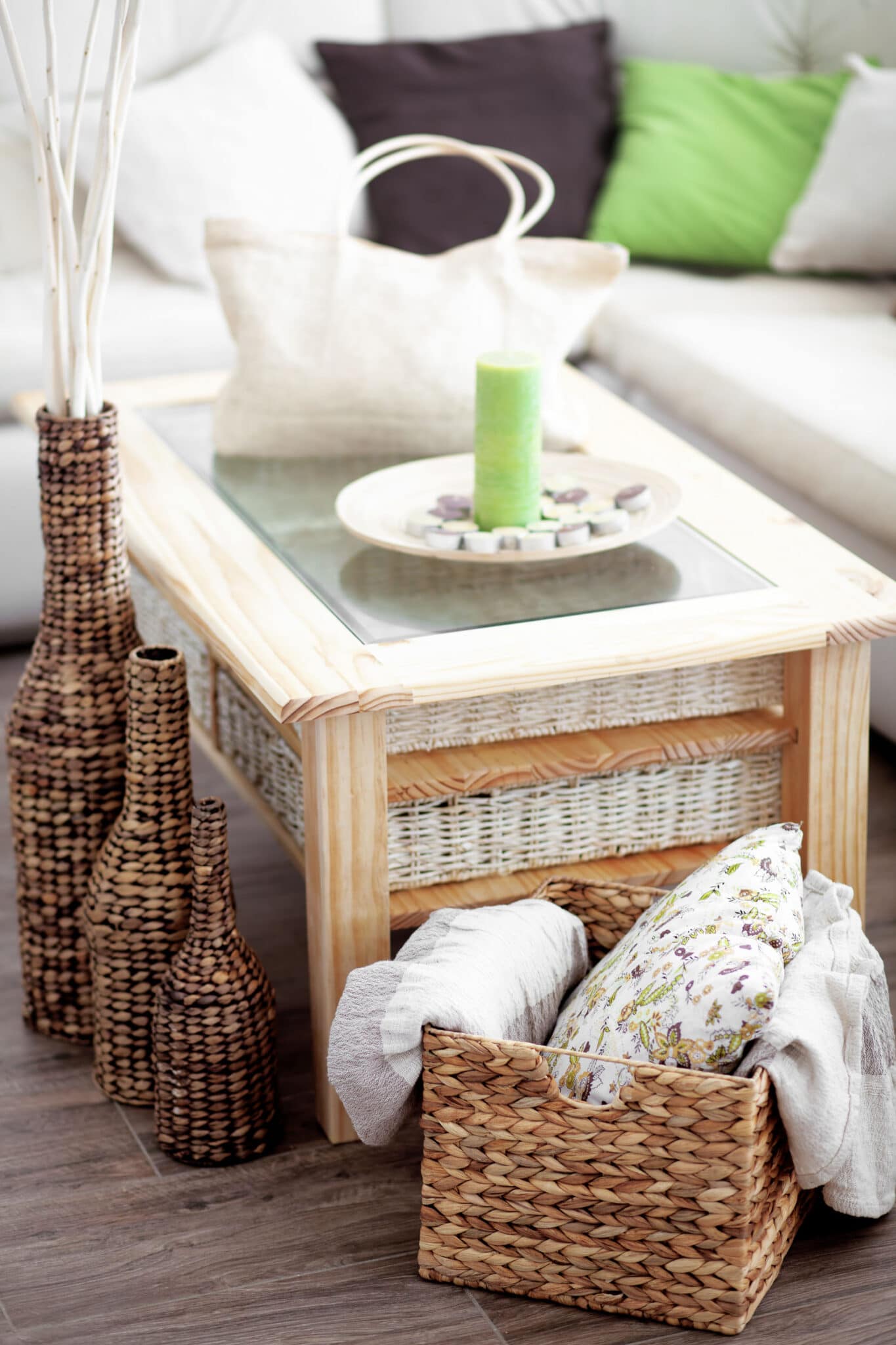 A wooden coffee table being used for blanket storage.