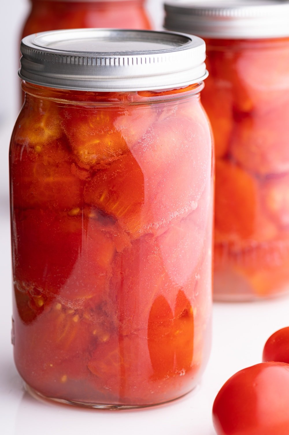 Jar of whole canned tomatoes.