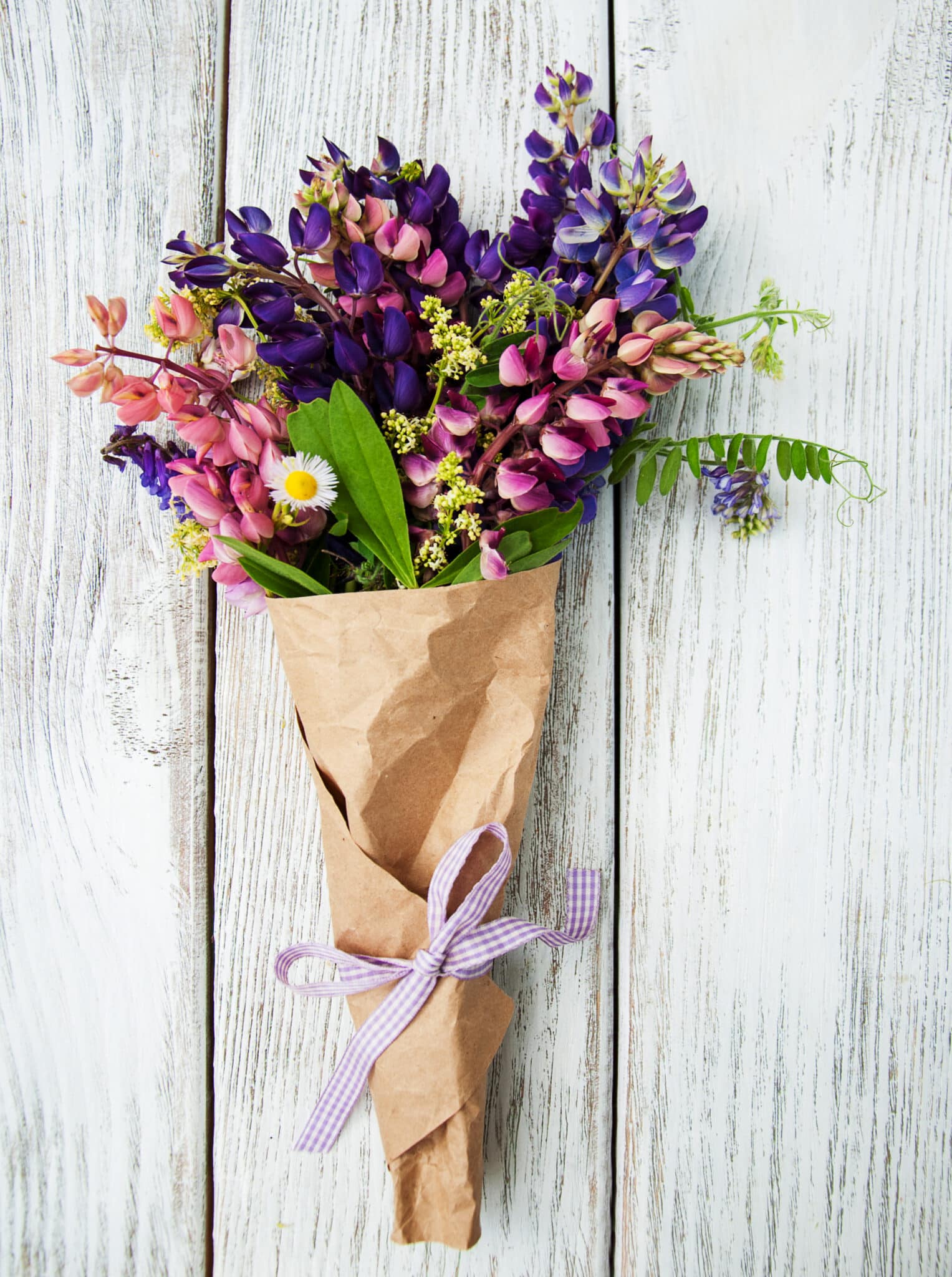 Lupin flowers on a old wooden table.
