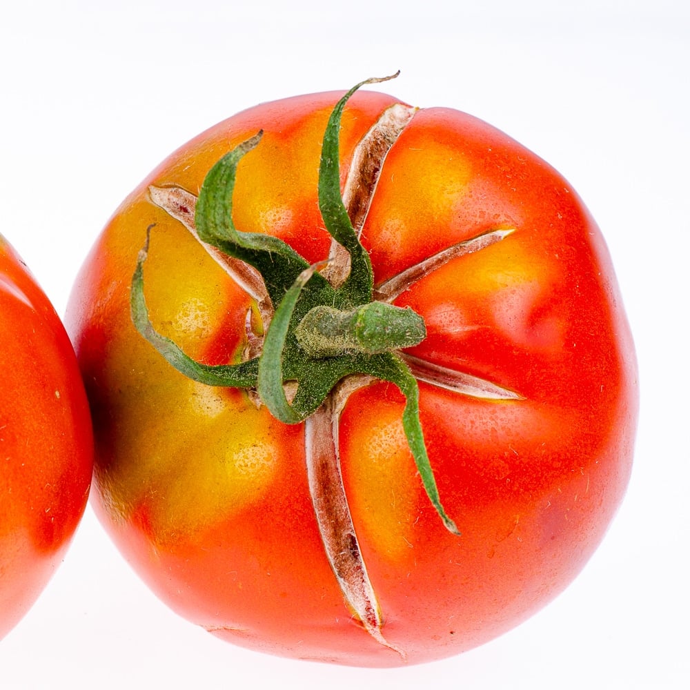 Tomato with radial splitting and cracking.