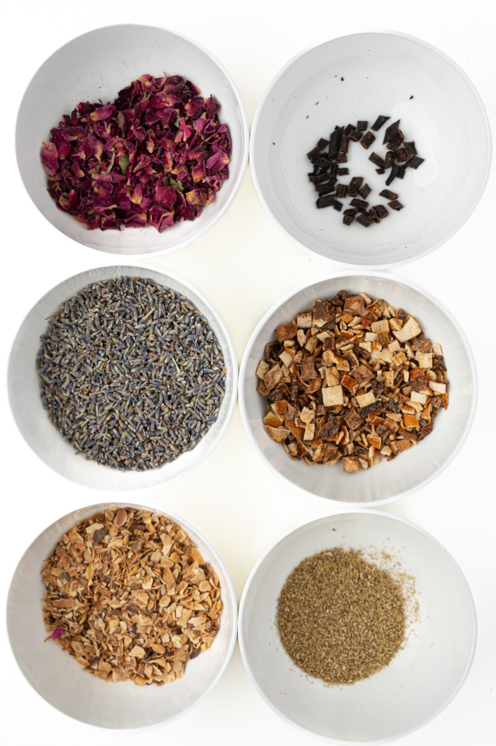 Image of some of our favorite tea additions to make our tea blends, including citrus rinds, florals like lavender and rose petals and chamomile.